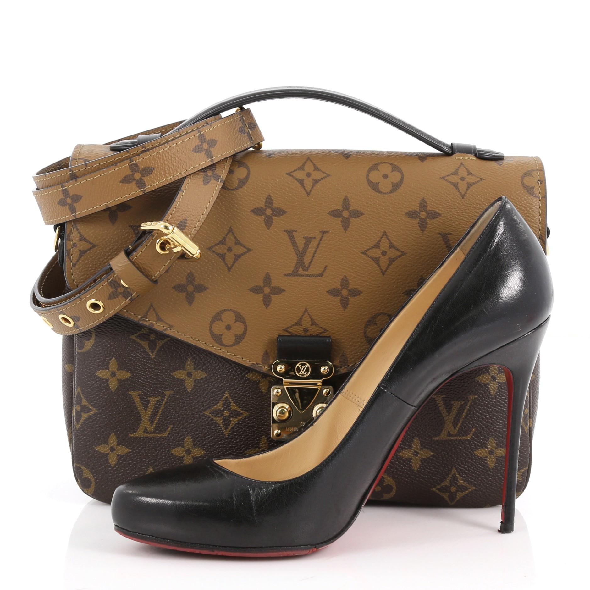 This authentic Louis Vuitton Pochette Metis Reverse Monogram Canvas is given a highly fashionable twist inspired by Nicolas Ghesquière’s work. Crafted from brown reverse monogram coated canvas, this chic bag features a top leather handle, an