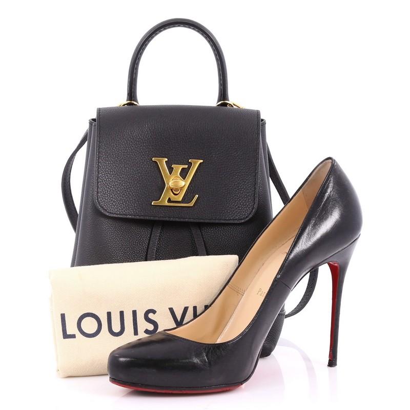 This authentic Louis Vuitton Lockme Backpack Leather Mini is a youthful daily companion for active fashionista. Crafted in black calf leather, this chic backpack features a leather top handle, adjustable should straps, LV logo turn lock and