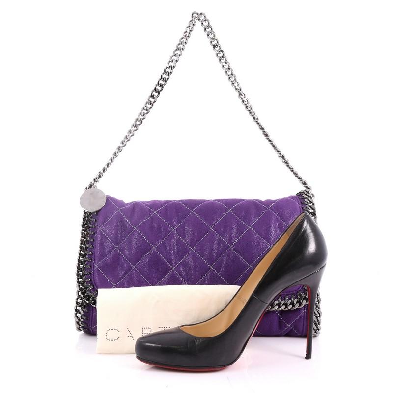 This authentic Stella McCartney Falabella Flap Bag Quilted Shaggy Deer is made for on-the-go moments. Crafted from purple quilted shaggy deer, this no-fuss, easy bag features gunmetal chain link handles and trim, whipstitched edges, a hanging logo