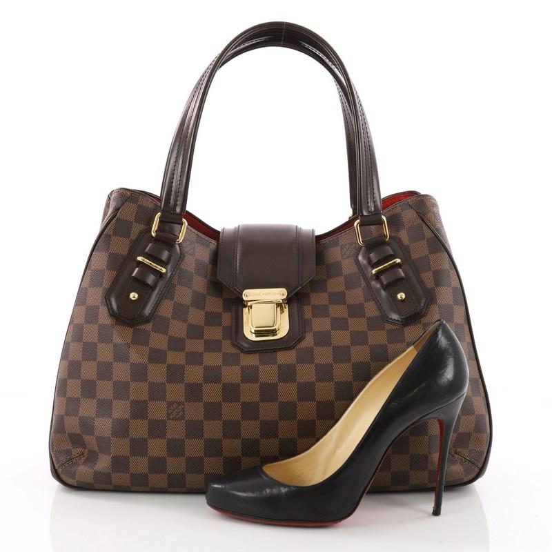This authentic Louis Vuitton Griet Handbag Damier is a marvelous tote for everyday use. Crafted from Louis Vuitton signature damier ebene coated canvas, this chic bag features dual-flat leather handles, brown leather trims, protective base studs and