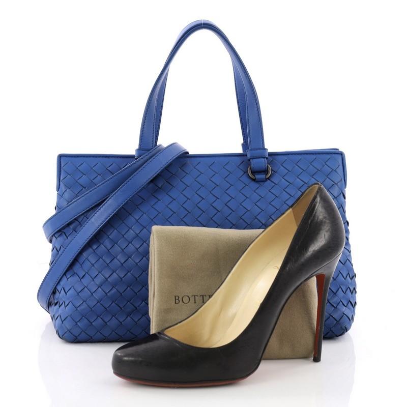 This authentic Bottega Veneta 2-Pocket Convertible Tote Intrecciato Nappa Medium is a timeless and versatile piece. Beautifully crafted in blue nappa leather in Bottega Veneta's signature intrecciato woven method, this stylish tote features dual