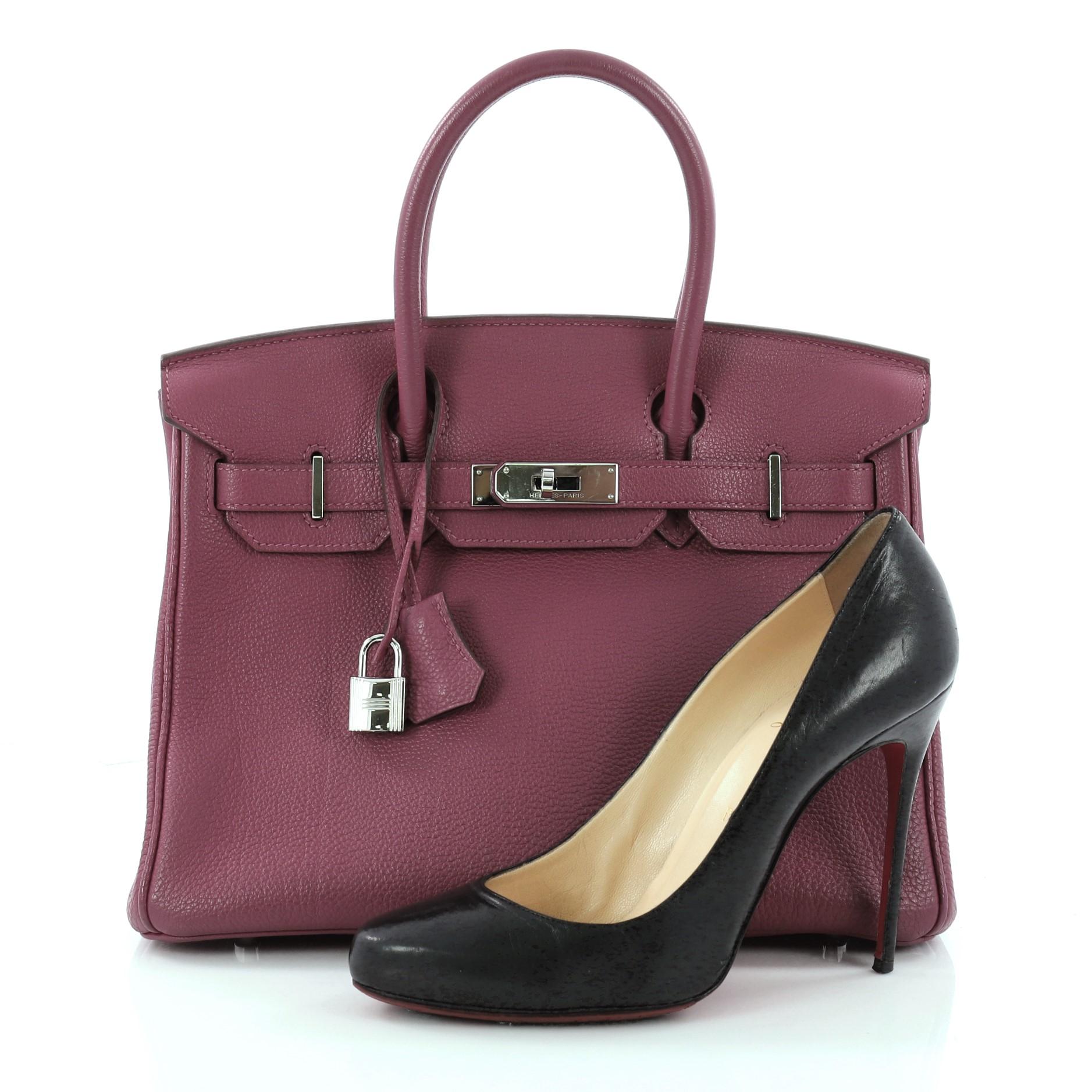 This authentic Hermes Birkin Handbag Cyclamen Togo with Palladium Hardware 30 is synonymous to traditional Hermes luxury. Crafted with sturdy, scratch-resistant Cyclamen purple Togo leather, this eye-catching luxurious tote is accented with polished