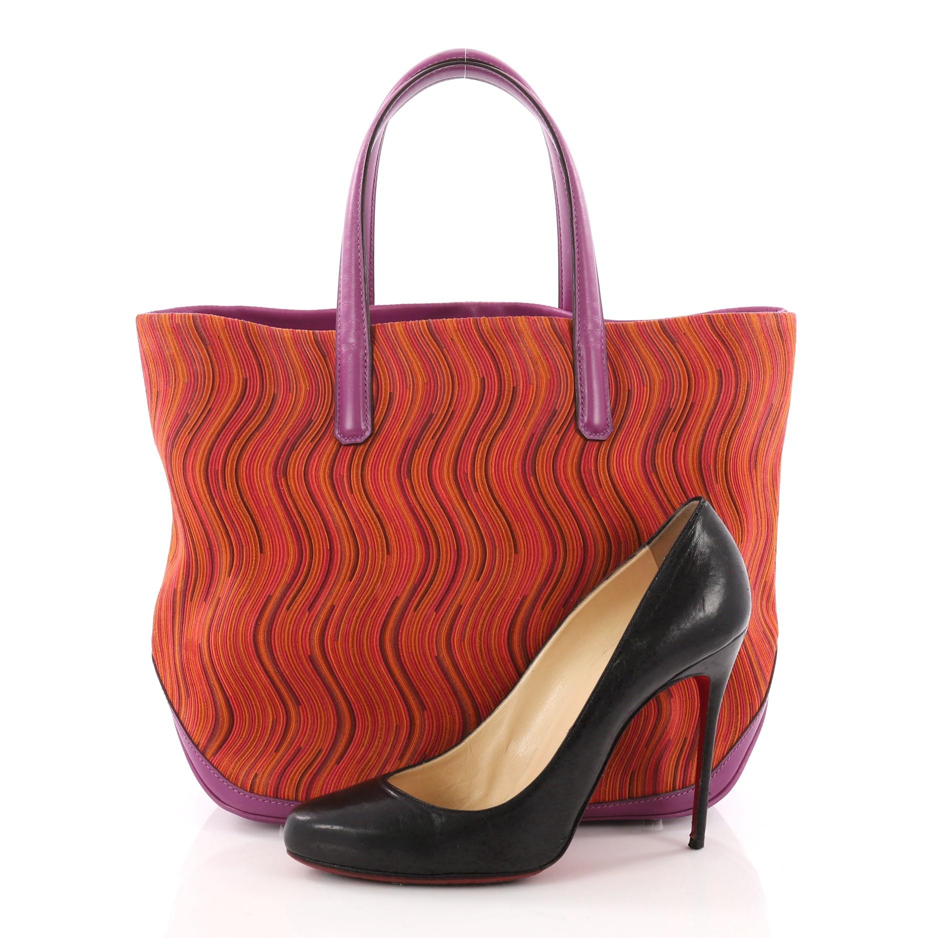 This authentic Hermes Canoe Tote Vibrato and Leather PM combines a simple and functional style from Hermes perfect for everyday use. Crafted from multicolor vibrato and purple leather, this versatile tote features dual flat leather handles. Its wide