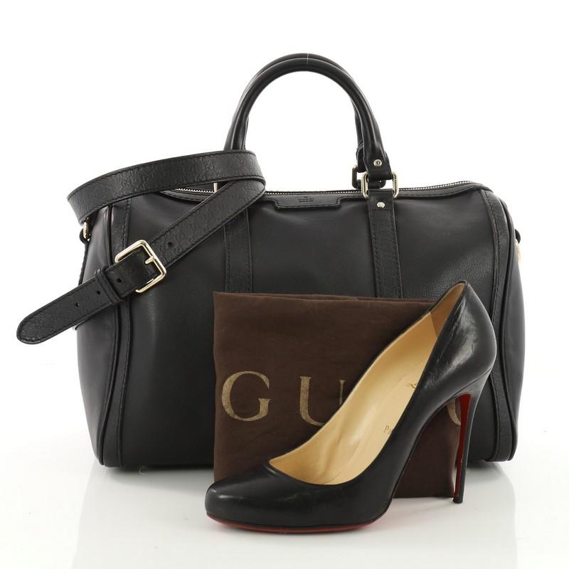 This authentic Gucci Joy Boston Bag Leather with Microguccissima Medium is a simple and stylish companion perfect for daily excursions. Crafted from black leather with microguccissima leather trims, this bag features dual-rolled handles and
