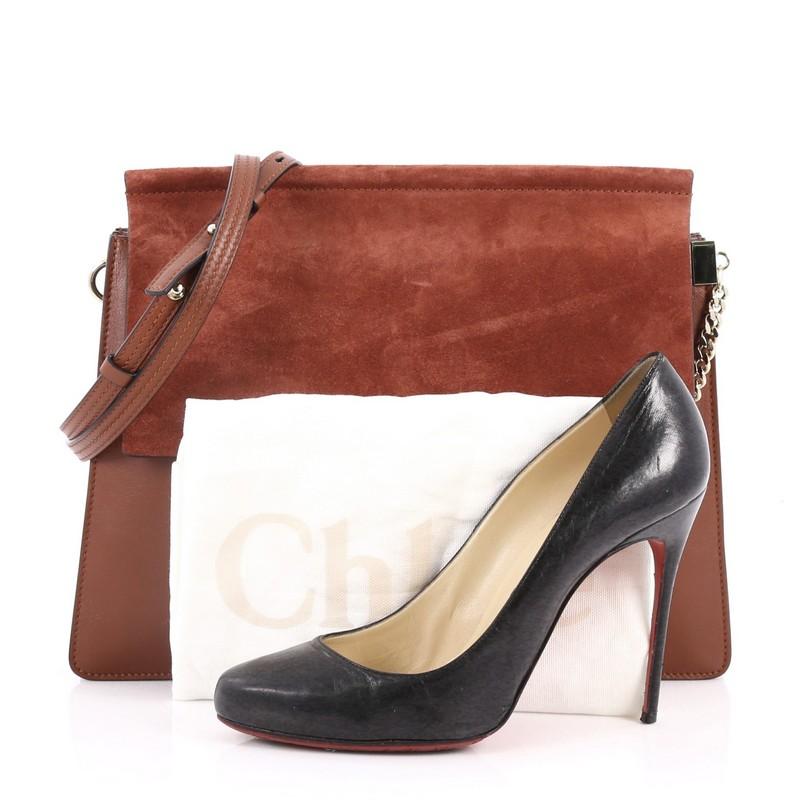 This authentic Chloe Faye Shoulder Bag Leather and Suede Medium personifies Chloe's unique luxe bohemian aesthetic with an ode to the 70's. Crafted in brown leather and suede, this sleek bag features a ring with chain, gusseted sides, stamped logo