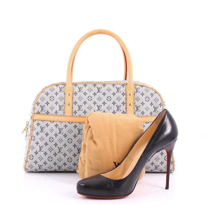 This authentic Louis Vuitton Marie Handbag Mini Lin is a great everyday city bag. Crafted in light blue mini lin monogram fabric, this sophisticated bag features dual- rolled leather handles, exterior front flat pocket, vacheta leather trims ang