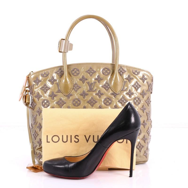 This authentic Louis Vuitton Fascination Lockit Handbag Patent Lambskin is perfect for your daily excursions. Crafted in light brown patent leather embroidered with LV's iconic monogram bouclette design, this bag features dual-rolled handles,