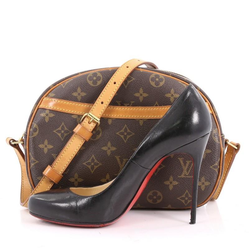 This authentic Louis Vuitton Blois Handbag Monogram Canvas is a simple, classic crossbody accessory from Louis Vuitton great for everyday use. Crafted from the brand's brown monogram canvas with vachetta leather trims, this rounded bag features