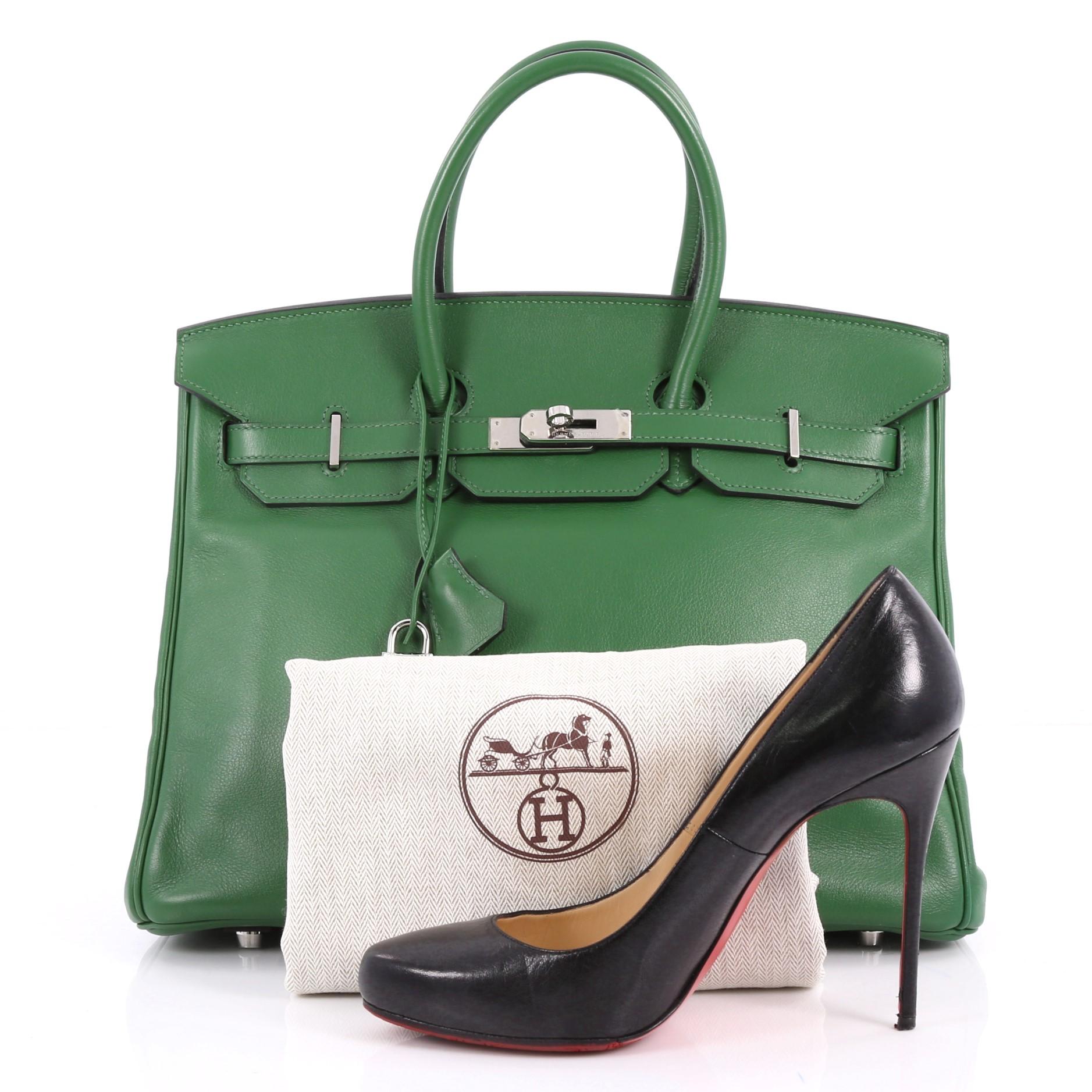 This authentic Hermes Birkin Handbag Vert Bengal Swift with Palladium Hardware 35 stands as one of the most-coveted and timeless bags fit for any fashionista. Constructed from scratch-resistant Vert Bengal swift leather, this bag features