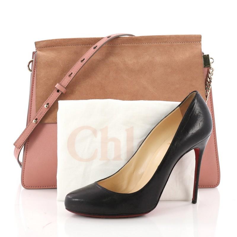 This authentic Chloe Faye Shoulder Bag Leather and Suede Medium personifies Chloe's unique luxe bohemian aesthetic with an ode to the 70's. Crafted in pink leather and suede, this sleek bag features a ring with chain, gusseted sides, stamped logo at