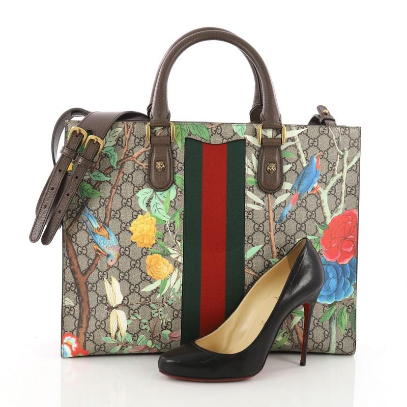 This authentic Gucci Animalier Web Top Handle Tote Tian Print GG Coated Canvas Large balances understated versatility with a glamorous flair. Crafted from brown GG coated canvas with Tian print, this stylish bag features dual rolled leather handles