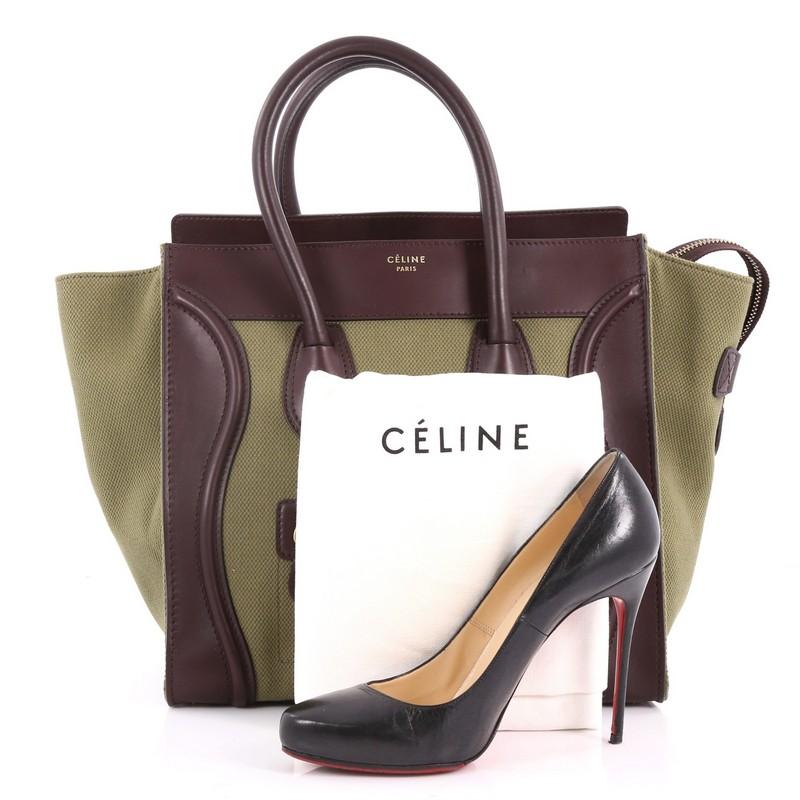 This authentic Celine Luggage Handbag Canvas and Leather Mini is one of the most sought-after bags beloved by fashionistas. Crafted from green canvas and brown leather, this minimalist tote features dual-rolled handles, an exterior front pocket,