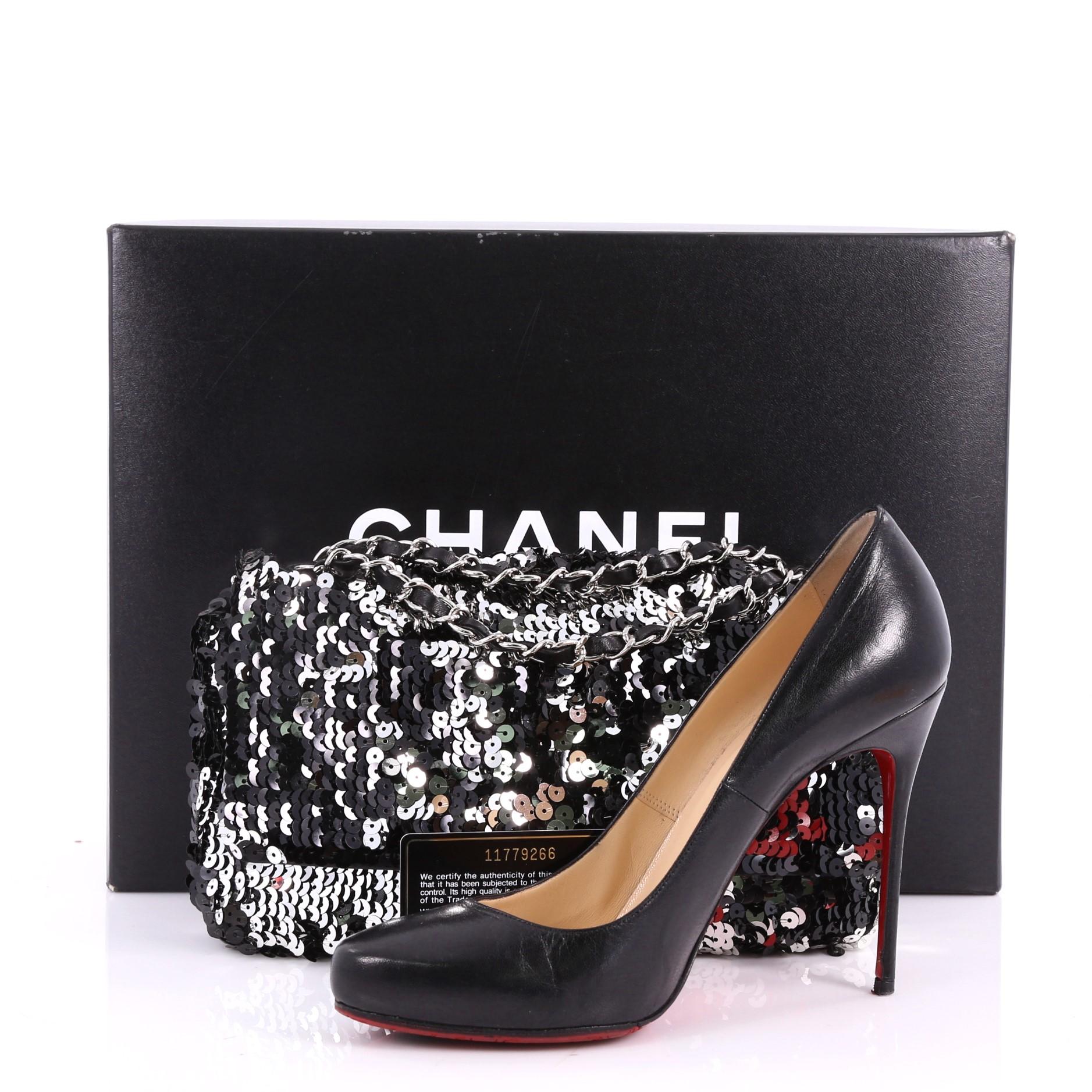 This authentic Chanel Summer Night Flap Bag Sequins with Leather Medium is a rare and beautiful piece perfect for your collection. Crafted from black sequins with leather base trim, this chic flap features woven-in leather chain strap and