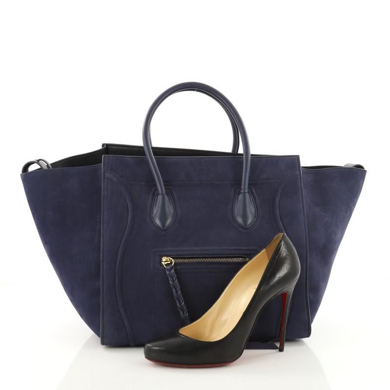 This authentic Celine Phantom Handbag Nubuck Medium is a vivid take on one of the season's hottest bags. Crafted from blue nubuck, this beloved bag features dual-rolled leather handles, front zipped pocket with braided leather pull, side flaps that