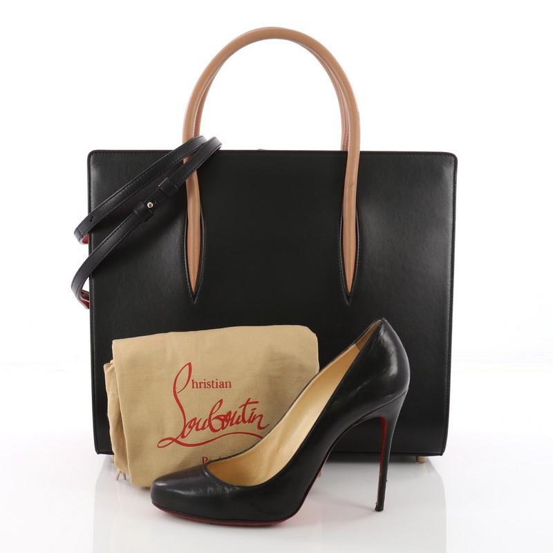 This authentic Christian Louboutin Paloma Tote Leather Large is an elegant, edgy handbag made for the modern woman. Crafted in black leather, this stand-out bag features dual-rolled leather handles, protective base studs, and gold-tone hardware
