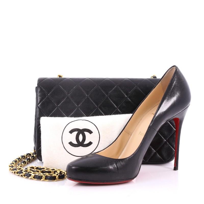 This authentic Chanel Vintage Full Flap Bag Quilted Lambskin Medium is a pure and feminine bag perfect for all occasions. Crafted from black quilted lambskin leather, this bag features woven-in leather chain strap, CC turn-lock closure and gold-tone