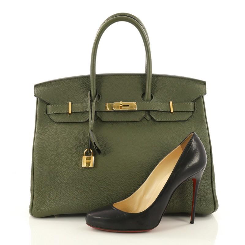This authentic Hermes Birkin Handbag Vert Canopee Togo with Gold Hardware 35 stands as one of the most-coveted and timeless bags fit for any fashionista. Constructed from scratch-resistant Vert Canopee Green Togo leather, this subtly sleek tote