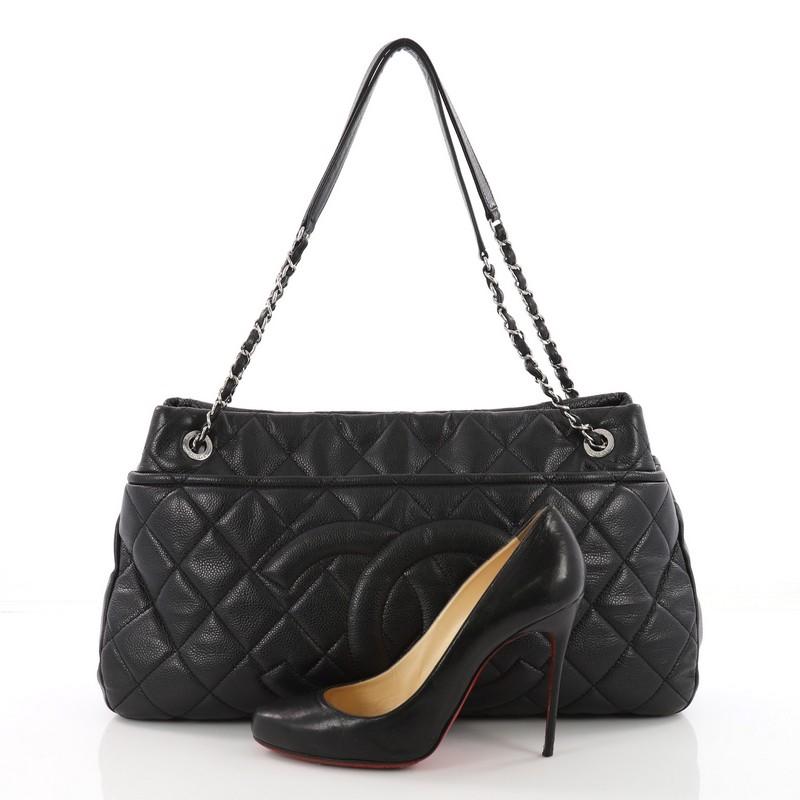 This authentic Chanel Timeless CC Shopping Tote Quilted Caviar Large is a classic design from the luxury brand made for everyday use. Crafted from black caviar leather, this tote features classic Chanel quilted diamond design, stitched Chanel CC