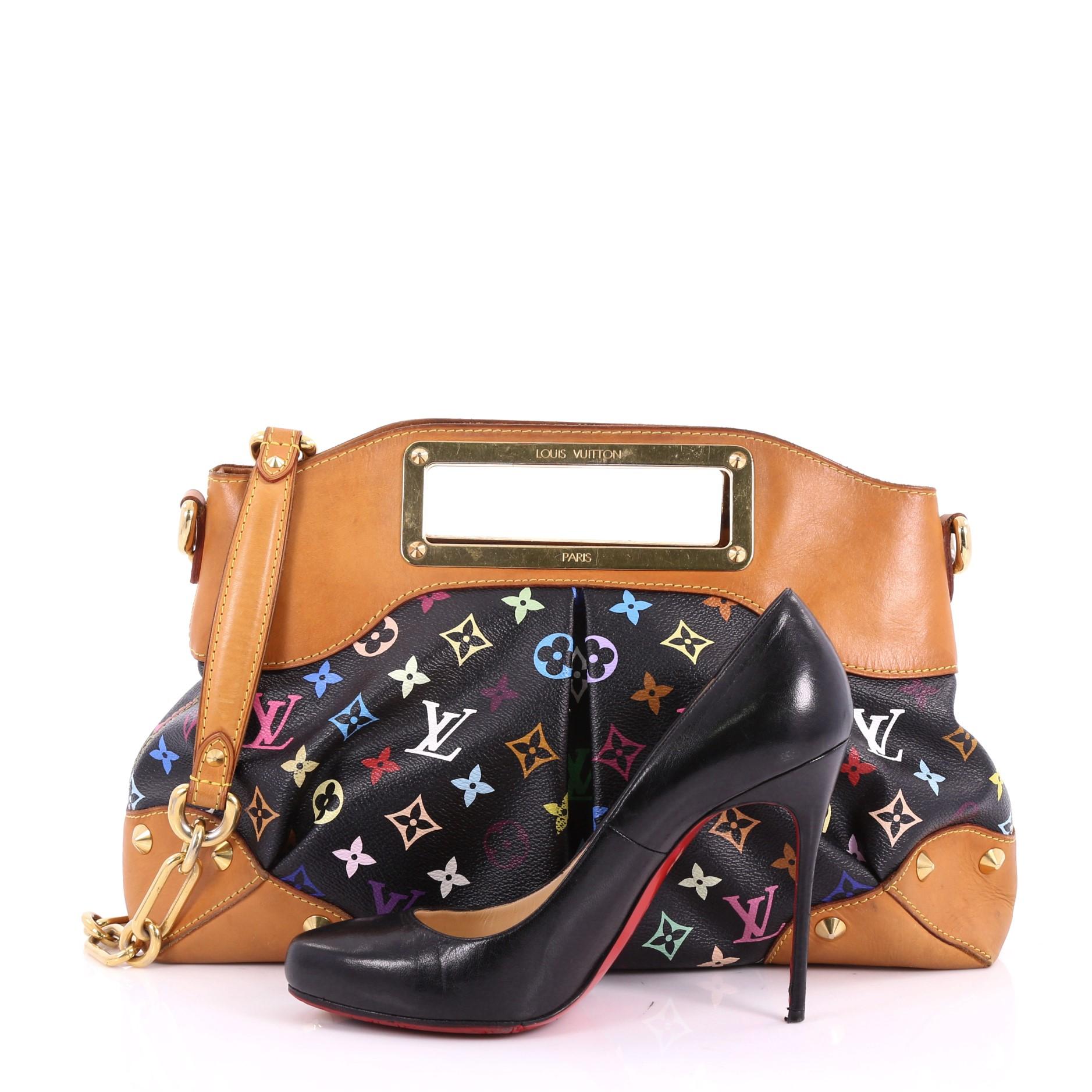 This authentic Louis Vuitton Judy Handbag Monogram Multicolor MM is a vibrant and colorful bag perfect for everyday. Featuring Takashi Murakami's popular black monogram multicolor coated canvas, this pleated feminine bag features a logo engraved