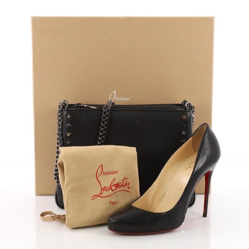This authentic Christian Louboutin Triloubi Chain Bag Leather Large balances an edgy-chic design. Crafted in black leather, this day-to-night chain bag features Louboutin's signature red-sole design on one side, double chain straps, multiple stud