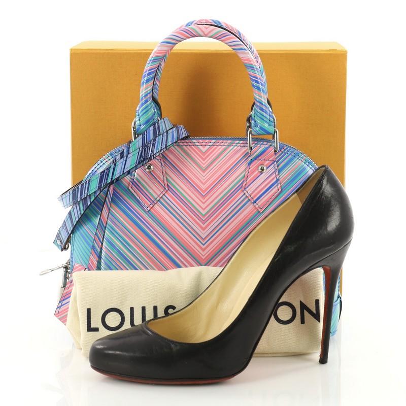 This authentic Louis Vuitton Alma Handbag Limited Edition Tropical Epi Leather BB is unique and modern in design perfect for LV lovers. Crafted in multicolor limited-edition tropical print epi leather, this petite dome-like bag features a sturdy