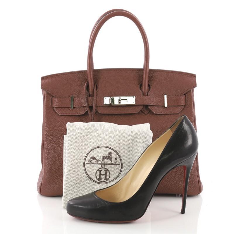 This authentic Hermes Birkin Handbag Sienne Togo with Palladium Hardware 30 is synonymous to traditional Hermes luxury. Crafted with sturdy, scratch-resistant brown Sienne togo leather, this eye-catching tote features dual-rolled top handles, a