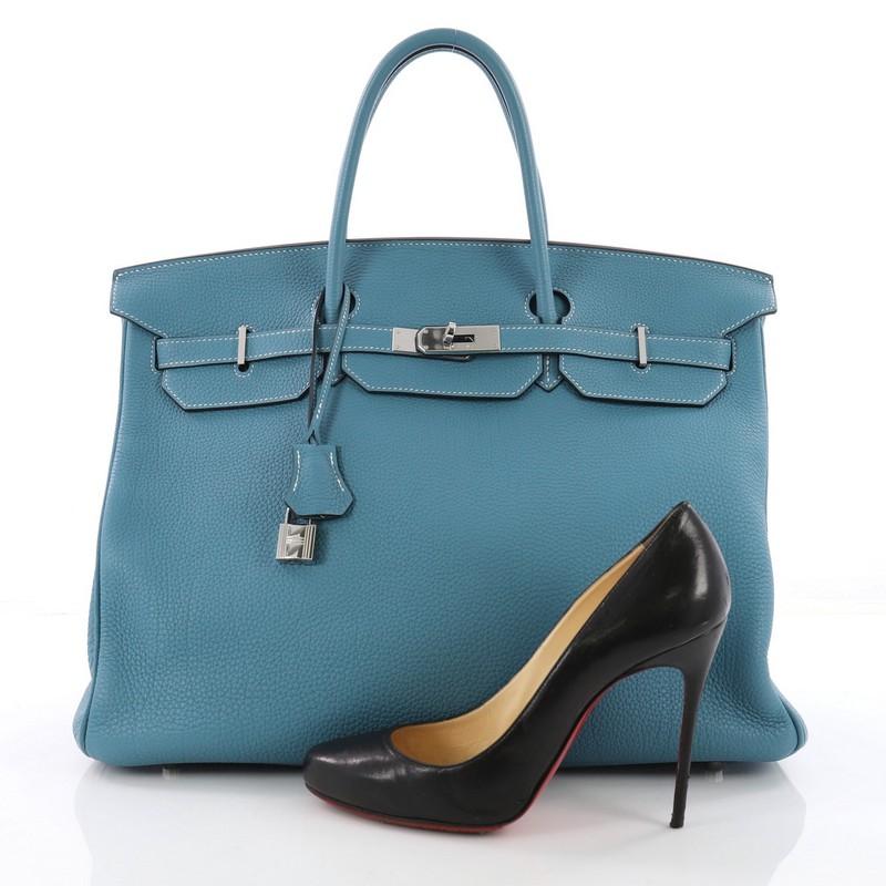 This authentic Hermes Birkin Handbag Blue Jean Togo with Palladium Hardware 40 stands as one of the most-coveted bags fit for any fashionista. Constructed from sturdy, scratch-resistant Blue Jean togo leather, this stand-out oversized tote features