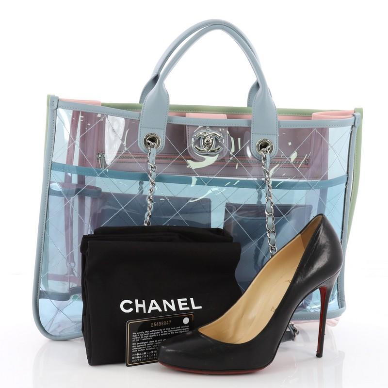 This authentic Chanel Coco Splash Shopping Tote Quilted PVC With Lambskin Medium is a highlight runway piece. Crafted in multicolor quilted PVC with lambskin leather trims, this stunning bag features dual woven-in leather chain straps with leather