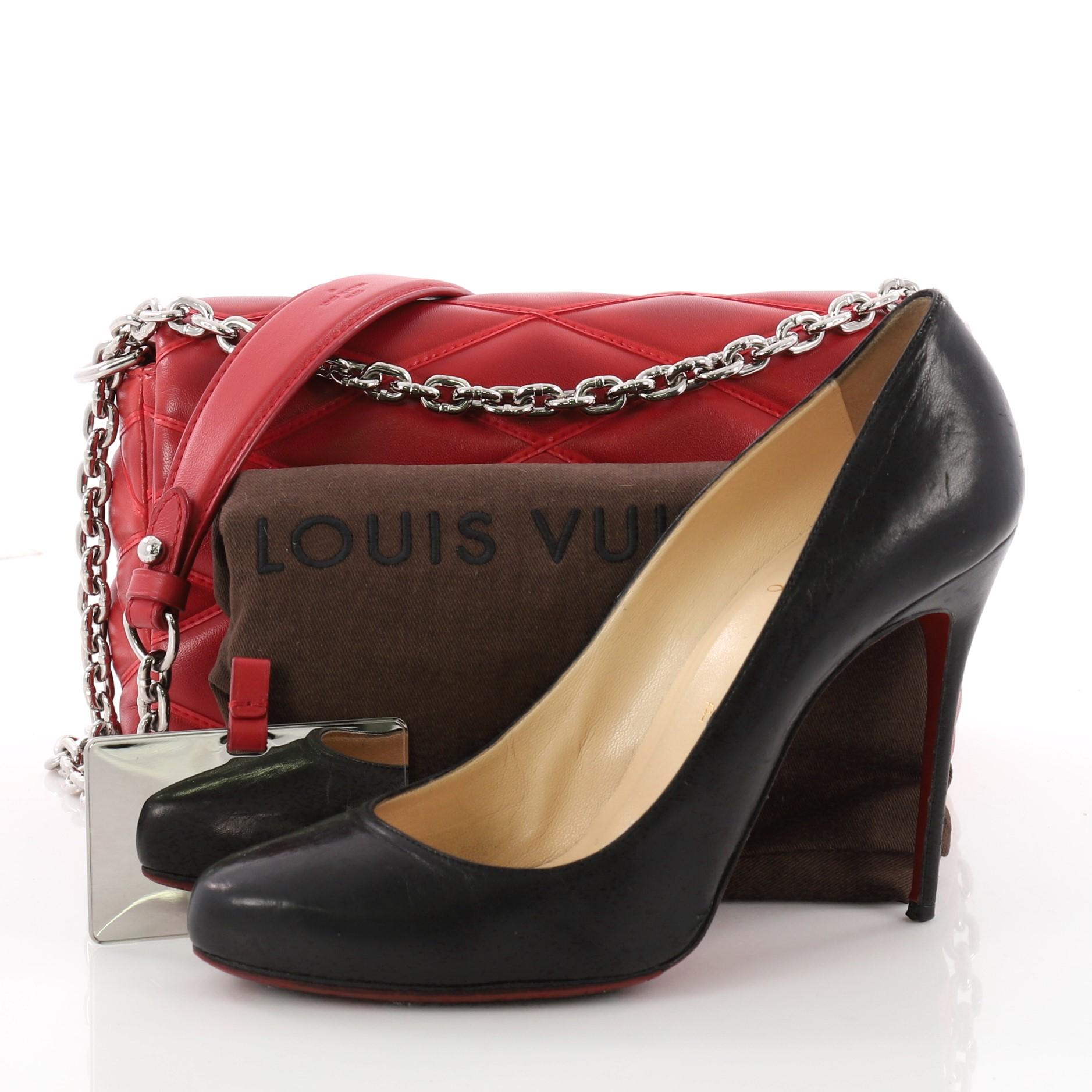 This authentic Louis Vuitton GO-14 Handbag Malletage Leather PM is a vintage-inspired modern bag. Crafted from red malletage quilted leather, this bag features a chain-link strap with leather shoulder pad, stunning LV twist-lock and silver-tone