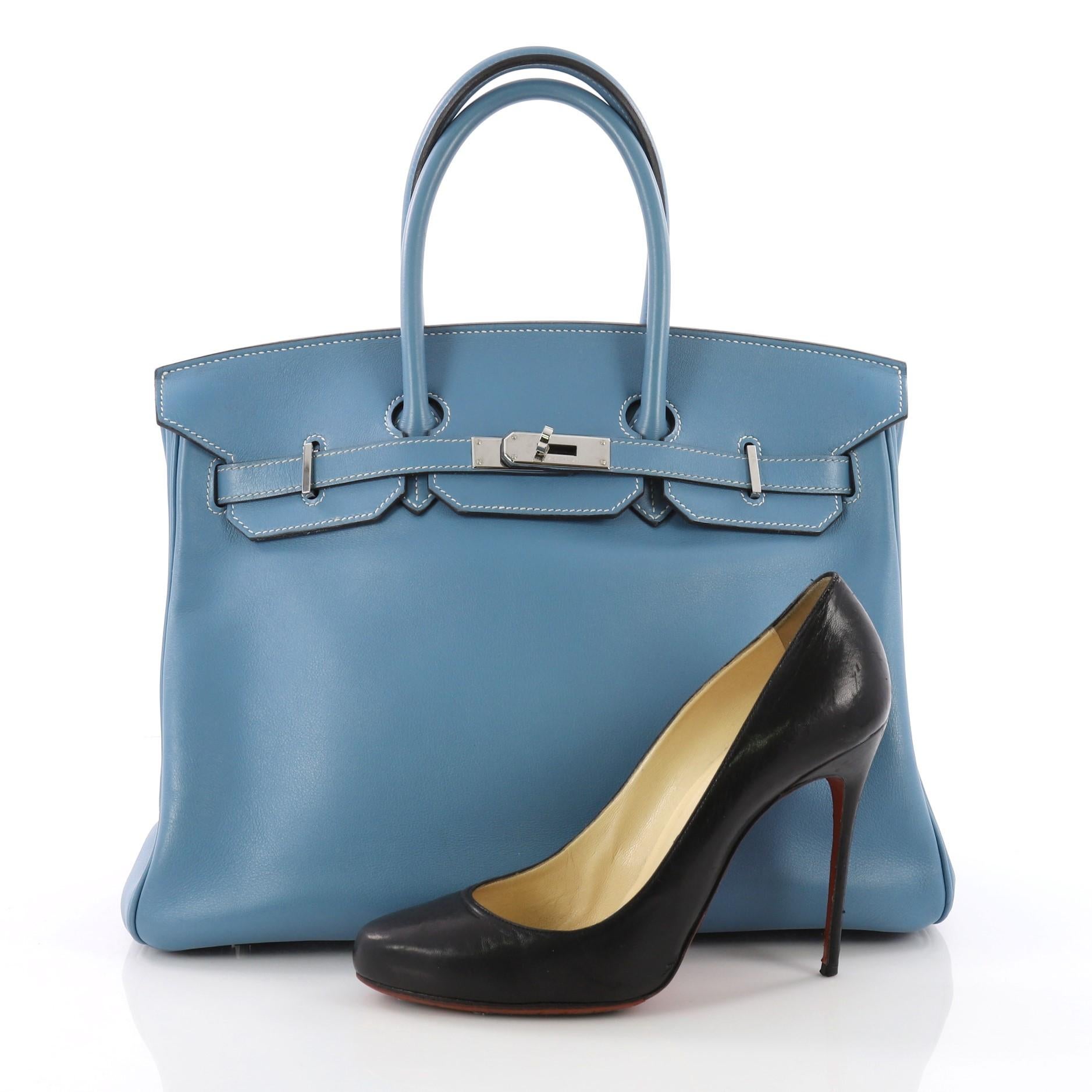 This authentic Hermes Birkin Handbag Blue Jean Swift with Palladium Hardware 35 stands as one of the most-coveted and timeless bags fit for any fashionista. Constructed from scratch-resistant Blue Jean swift leather, this bag features dual-rolled
