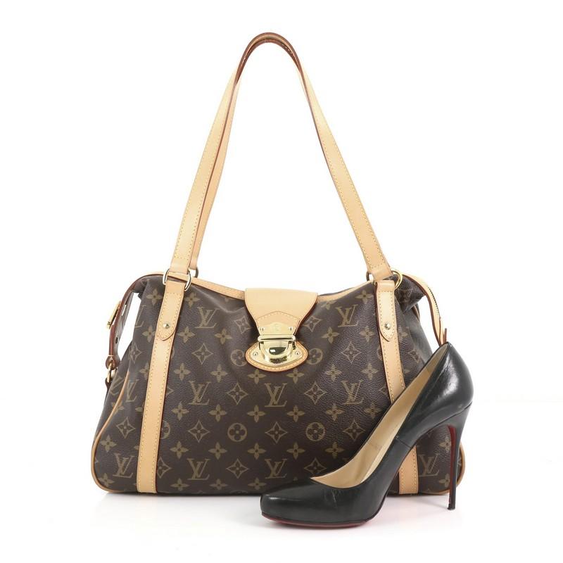 This Louis Vuitton Stresa Handbag Monogram Canvas PM, crafted in brown monogram coated canvas, features vachetta leather straps and trims and gold-tone hardware. Its top zip closure opens to brown fabric interior with slip pockets. Authenticity code