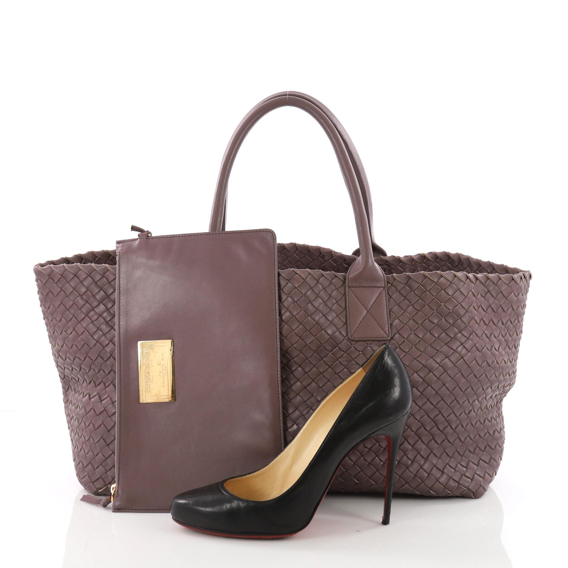 This Bottega Veneta Cabat Tote Intrecciato Nappa Medium, crafted in purple intrecciato woven nappa leather, features dual rolled handles, and gold-tone hardware. Its wide open top showcases a purple intrecciato nappa leather interior. **Note: Shoe