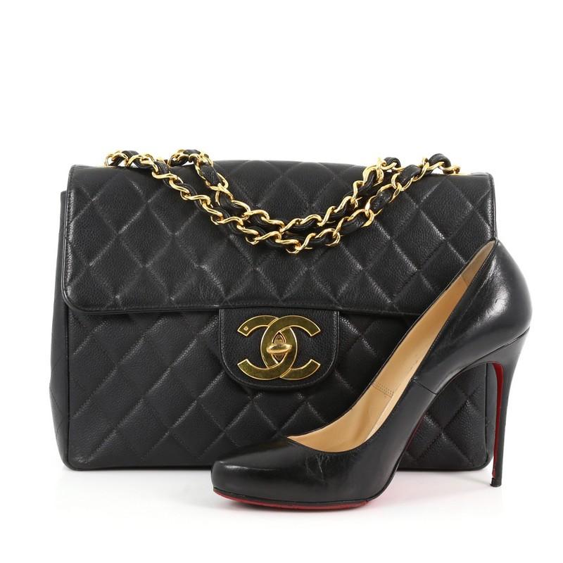 This authentic Chanel Vintage Classic Single Flap Bag Quilted Caviar Maxi is a timeless essential for any modern woman. Crafted in black quilted caviar leather, this classic flap bag features a woven-in leather chain strap, exterior back pocket, CC