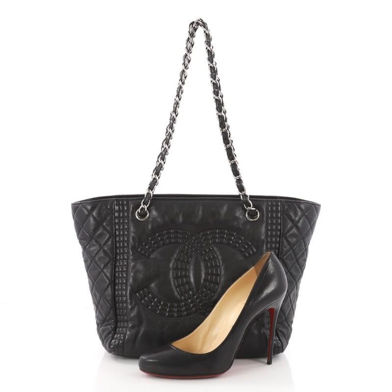 This authentic Chanel Coco Bengal Shopping Tote Calfskin Medium is made for everyday elegance. Crafted from black calfskin leather, this chic and stylish bag features dual woven-in leather handles, large CC logo at front, diamond quilted sides, and