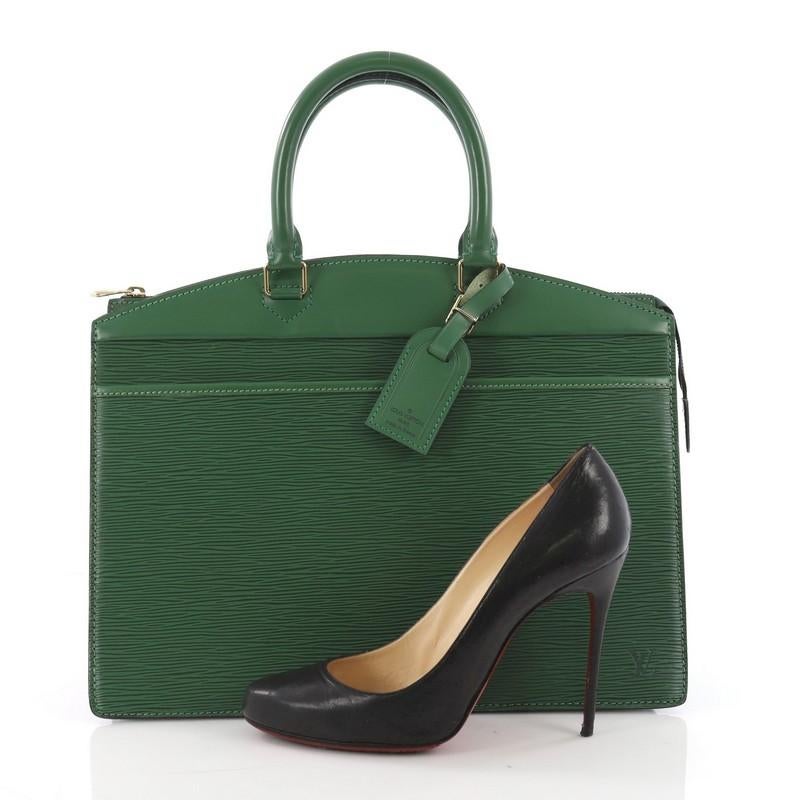 This Louis Vuitton Riviera Handbag Epi Leather, crafted from green epi leather, features dual rolled leather handles, full-length outer front pocket, and gold-tone hardware. Its zip closure opens to a dark gray leather interior with multiple side