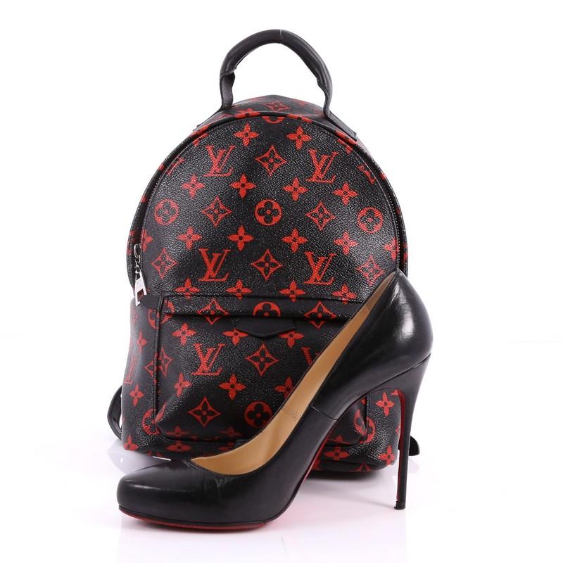 This authentic Louis Vuitton Palm Springs Backpack Limited Edition Monogram Infrarouge PM is a standout made for care-free urban fashionistas. Crafted from black and red monogram infrarouge coated canvas, this cult-favorite backpack features padded