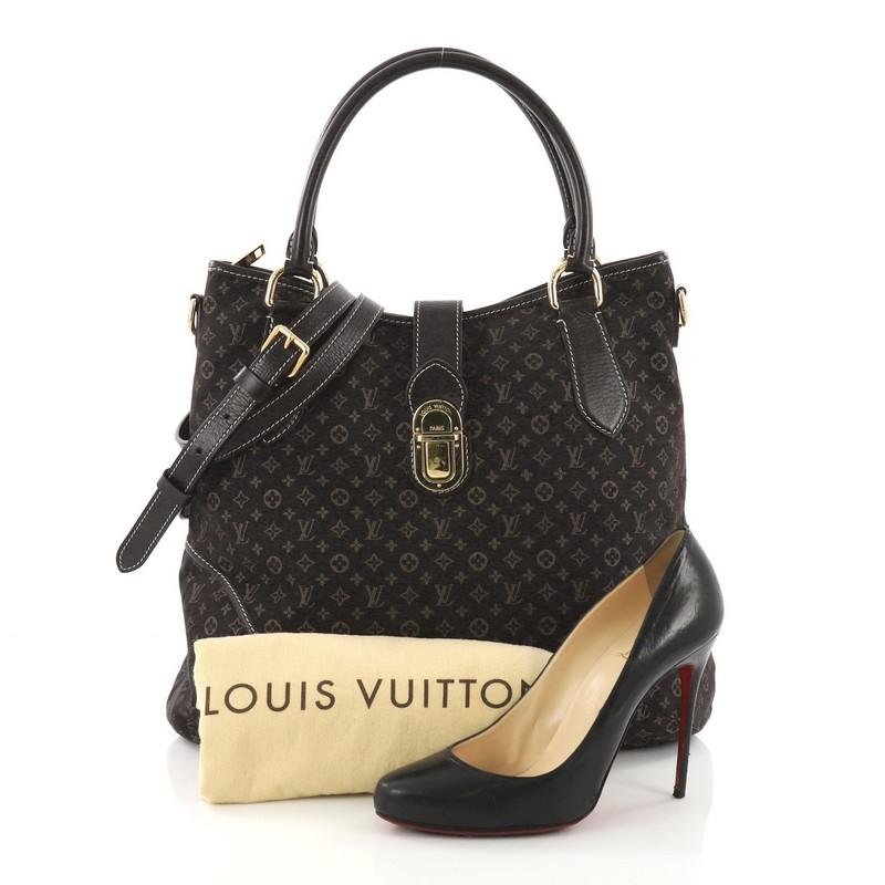 This Louis Vuitton Elegie Handbag Monogram Idylle, crafted from brown monogram idylle, features dual rolled leather handles, dark brown leather trims and gold-tone hardware accents. Its zip closure with flap tab and push-lock closure opens to a