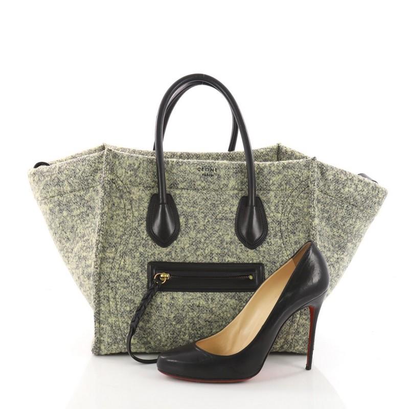 This Celine Phantom Handbag Wool Medium, crafted from green wool, features an exterior front zip pocket with braided zipper pull, dual rolled handles and aged gold-tone hardware. Its roomy green wool interior with zipped pockets. **Note: Shoe