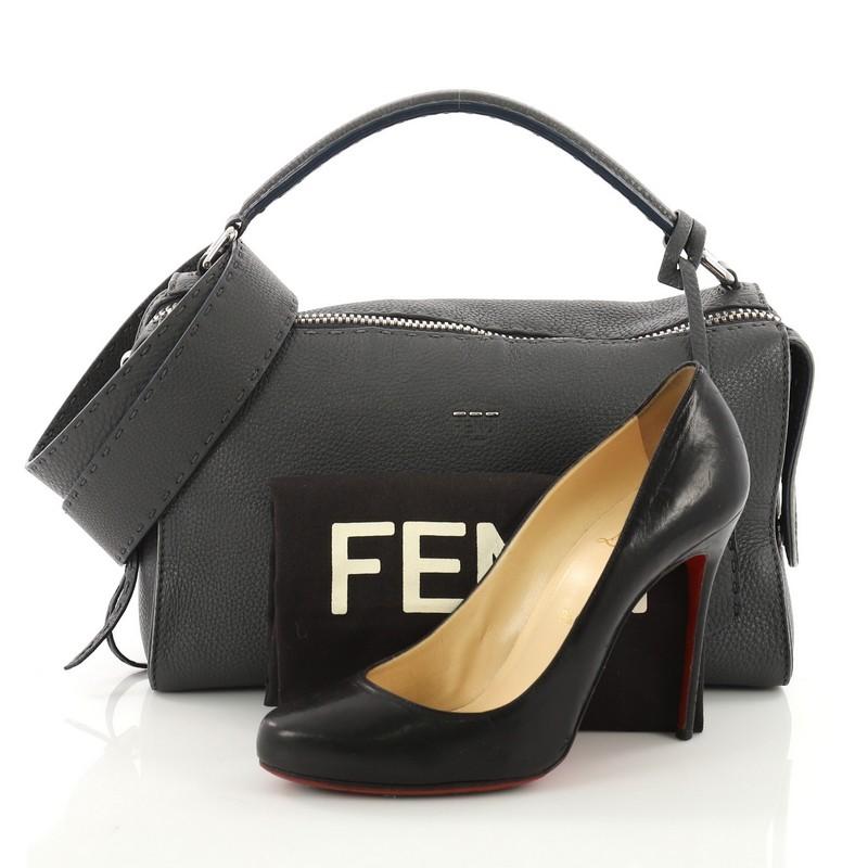 This Fendi Selleria Lei Bag Leather, crafted from grey leather, features looping leather handles and silver-tone hardware. Its zip closure opens to a grey microfiber interior with zip and slip pockets. **Note: Shoe photographed is used as a sizing