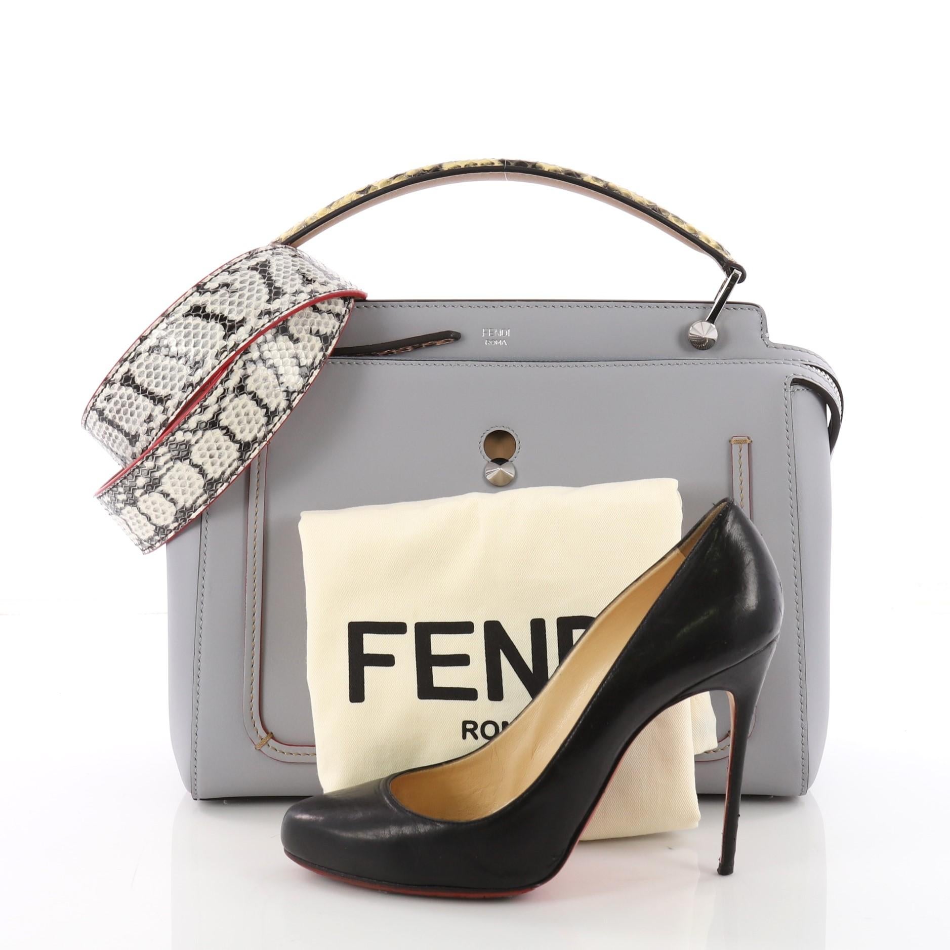 This Fendi DotCom Convertible Satchel Leather with Elaphe Medium, crafted from light blue leather with elaphe, features a flat top handle, distinctive conical stud embellishment, Fendi Roma logo, and silver-tone hardware. Its extended zip closure