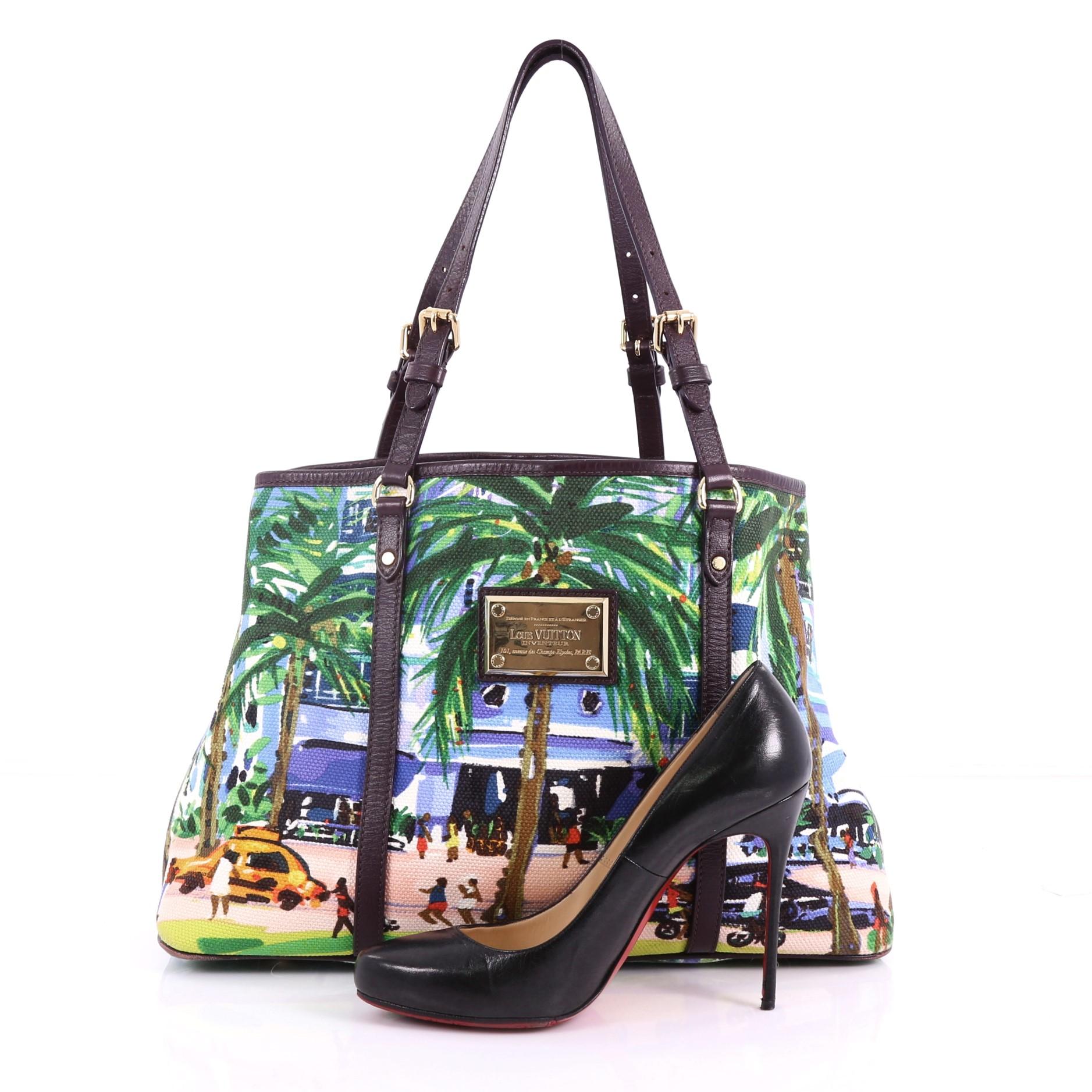 This Louis Vuitton Ailleurs Cabas Limited Edition Printed Canvas PM, crafted from multicolor printed canvas, features the Promenade painting of British artist Pippa Cunningham, dual adjustable flat leather handles, and gold-tone hardware. Its
