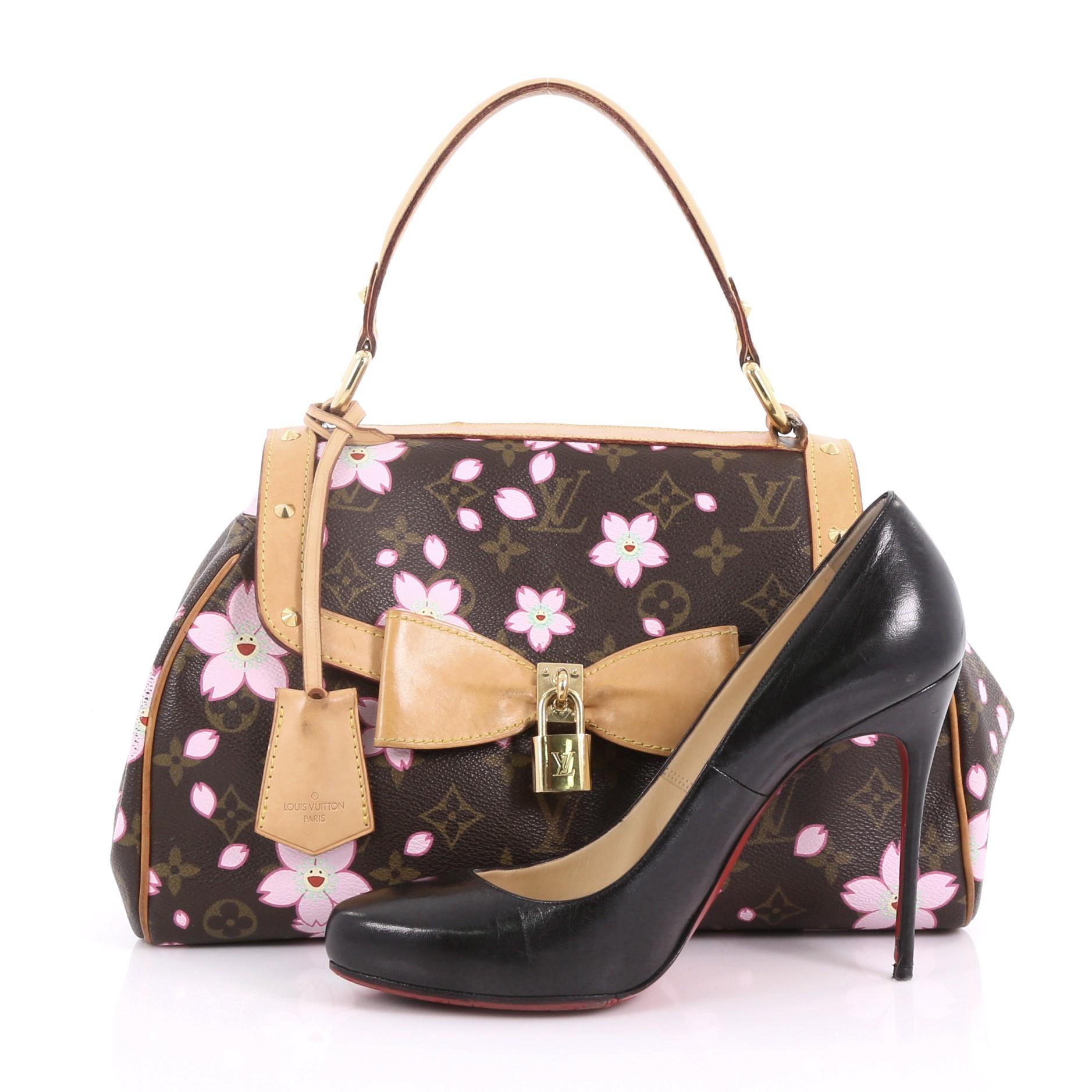 This Louis Vuitton Retro Bag Limited Edition Cherry Blossom, crafted from brown monogram coated canvas with cherry blossom prints by Takashi Murakami, features a single looped vachetta leather handle, frontal flap with oversized bow, and gold-tone