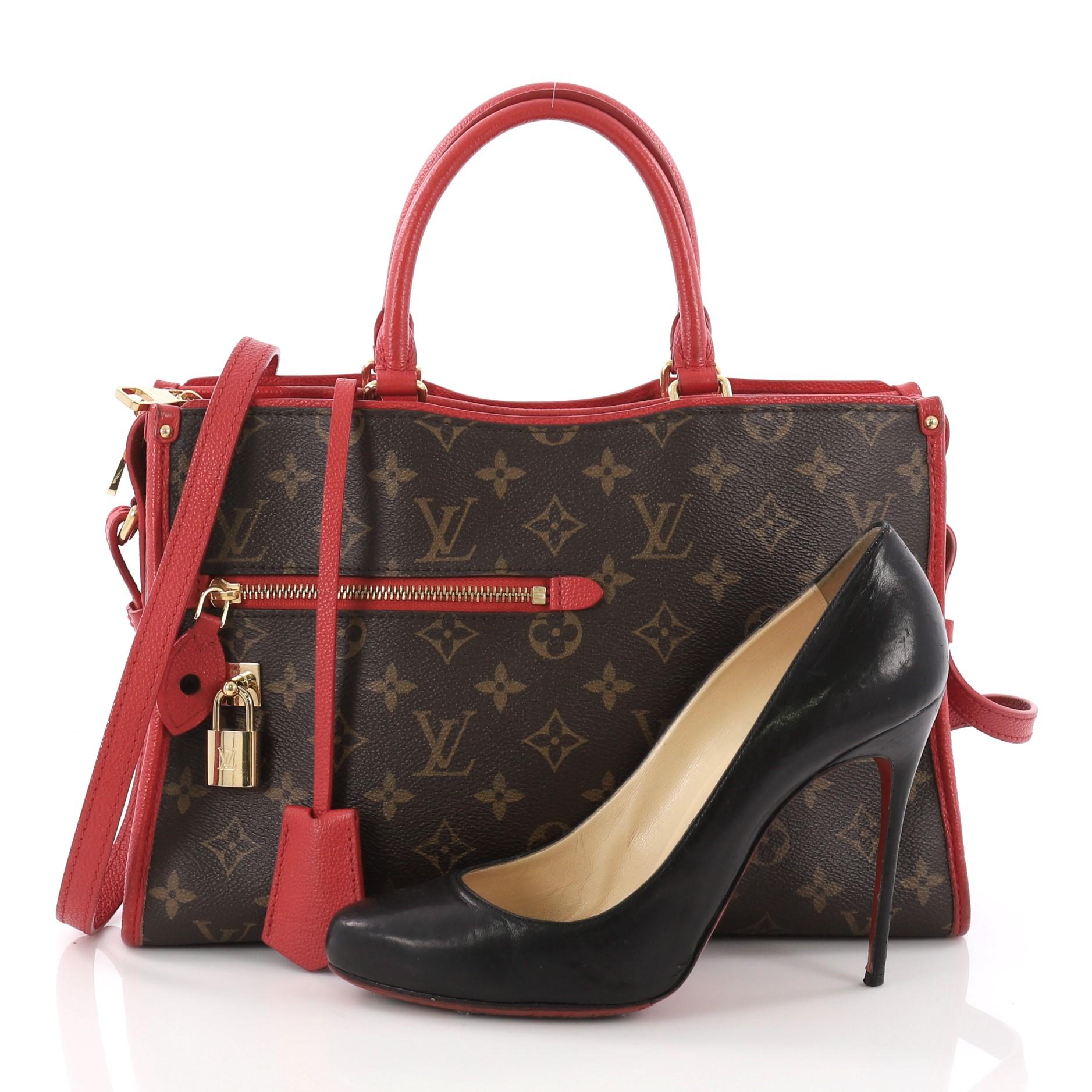 This Louis Vuitton Popincourt NM Handbag Monogram Canvas PM, crafted from brown monogram coated canvas, features dual rolled leather handles, exterior zip pocket, two large outside pockets, and gold-tone hardware. Its zip closure opens to a red