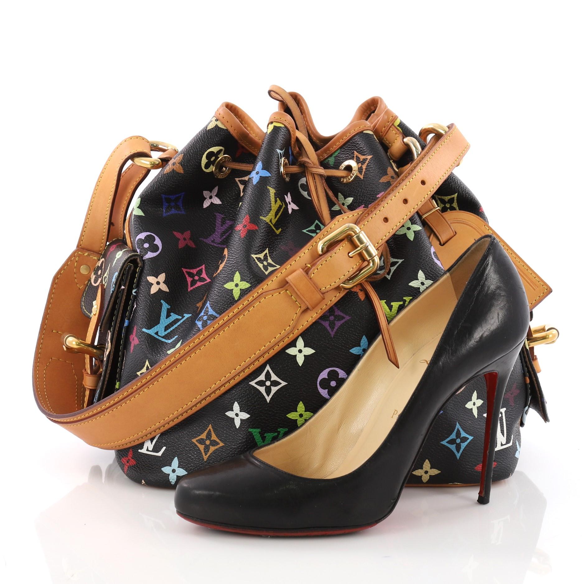 This Louis Vuitton Petit Noe Handbag Monogram Multicolor, crafted from black monogram coated canvas with vachetta leather base and trims, features leather drawstrings, adjustable shoulder straps and gold-tone hardware. Its drawstring closure opens