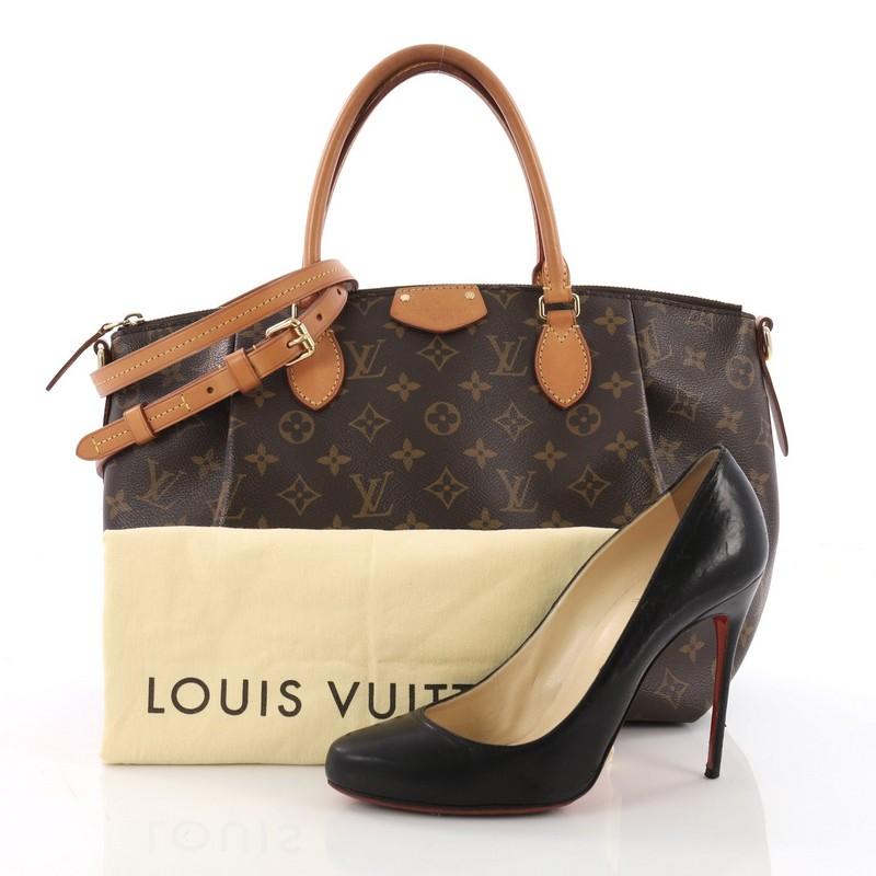This Louis Vuitton Turenne Handbag Monogram Canvas MM, crafted in brown monogram coated canvas, features dual rolled leather handles, front pleats and gold-tone hardware. Its zip closure opens to a burgundy fabric interior with slip pockets.