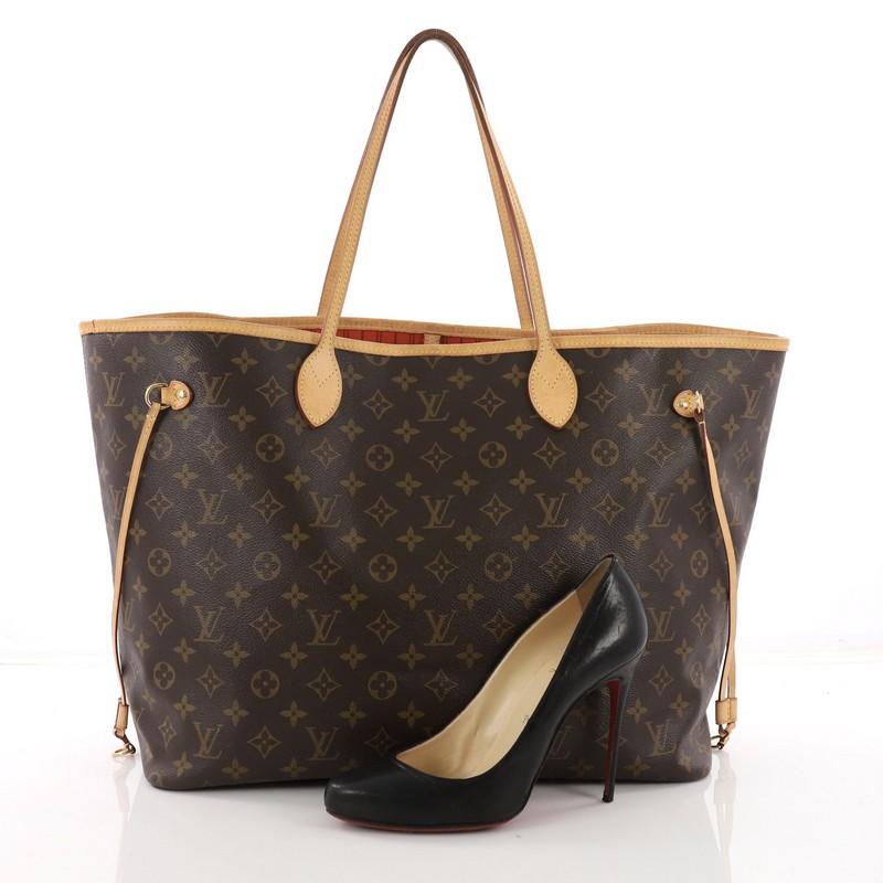 This Louis Vuitton Neverfull NM Tote Monogram Canvas GM, crafted from brown monogram coated canvas, features dual slim leather handles, side drawstrings and gold-tone hardware. Its hook closure opens to an orange striped fabric interior with a side