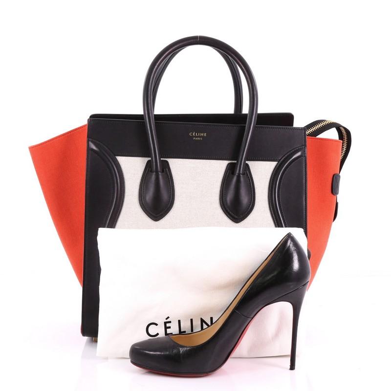 This Celine Tricolor Luggage Handbag Canvas and Leather Mini, crafted from beige and red canvas and black leather, features dual rolled handles, an exterior front pocket, and gold-tone hardware. Its zip closure opens to a black leather interior with
