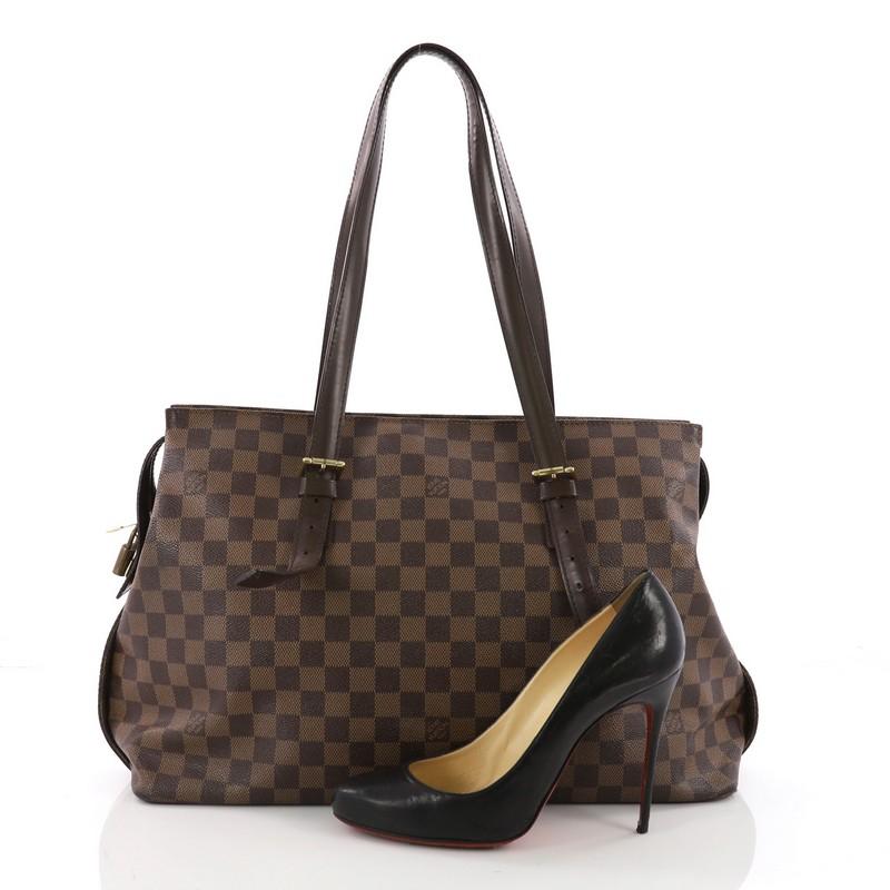 This Louis Vuitton Chelsea Handbag Damier, crafted from damier ebene coated canvas, features a simple silhouette, long adjustable shoulder straps, and gold-tone hardware. Its top double zipper closure opens to an orange fabric interior with zip