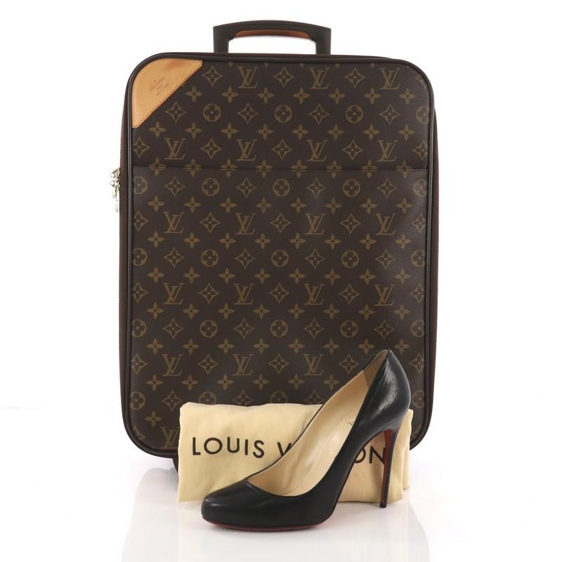 This Louis Vuitton Pegase Luggage Monogram Canvas 45, crafted from brown monogram coated canvas, features a retractable handle with lock button and a rolling system, cowhide leather trimmings and gold-tone hardware. Its all-around zipper closure