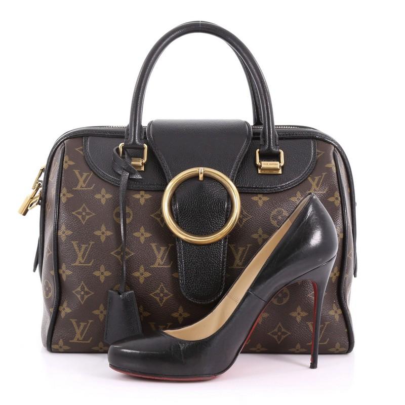 This Louis Vuitton Speedy Handbag Limited Edition Golden Arrow, crafted from brown monogram coated canvas, features a black leather flap with large brass-tone buckle and a magnetic snap button underneath, dual rolled handles, black leather trims and